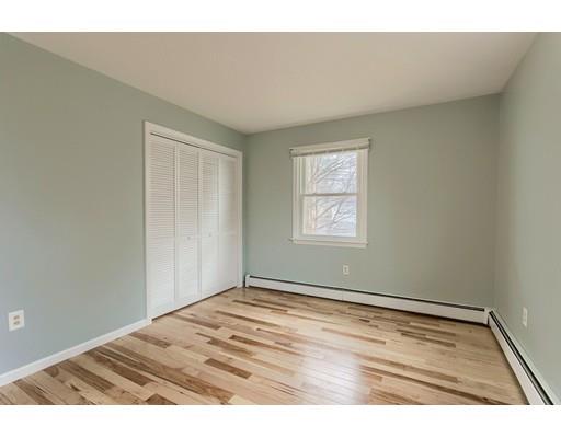 42 Corey Hill Road Ashburnham, MA 01430 - Photo 17 of 27 an empty room with wooden floor and windows