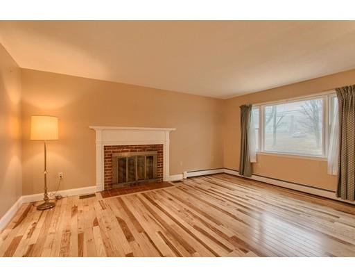 42 Corey Hill Road Ashburnham, MA 01430 - Photo 5 of 27 a view of an empty room with a fireplace and a window