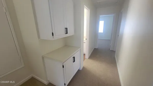 a bathroom with a sink toilet and mirror