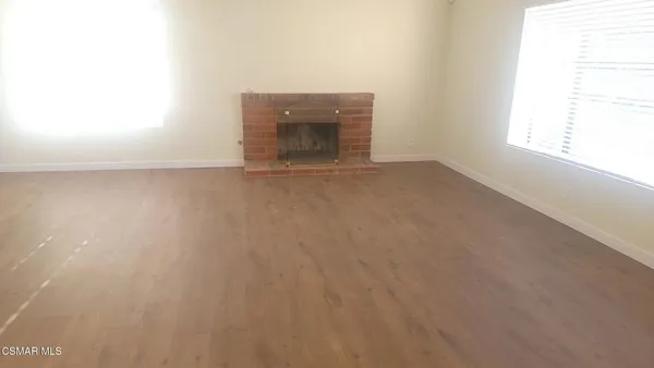 an empty room with a fireplace