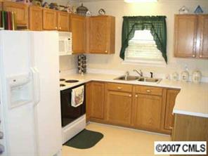 6537 Nevin Road Charlotte, NC 28262 - Photo 4 of 8 a utility room with sink dryer and washer