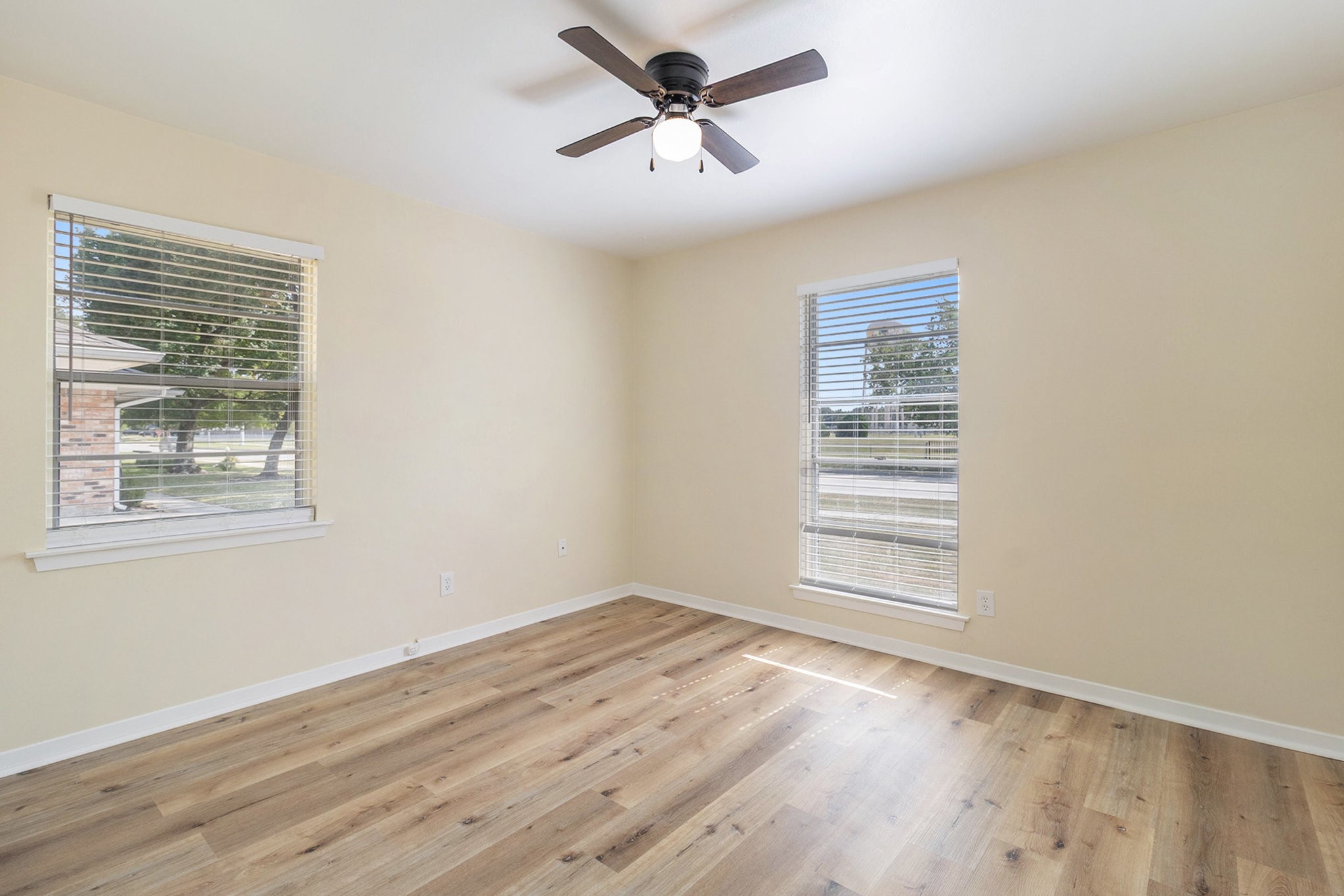10331 Collingswood Road La Porte, TX 77571 - Photo 11 of 29 a view of empty room with wooden floor and fan