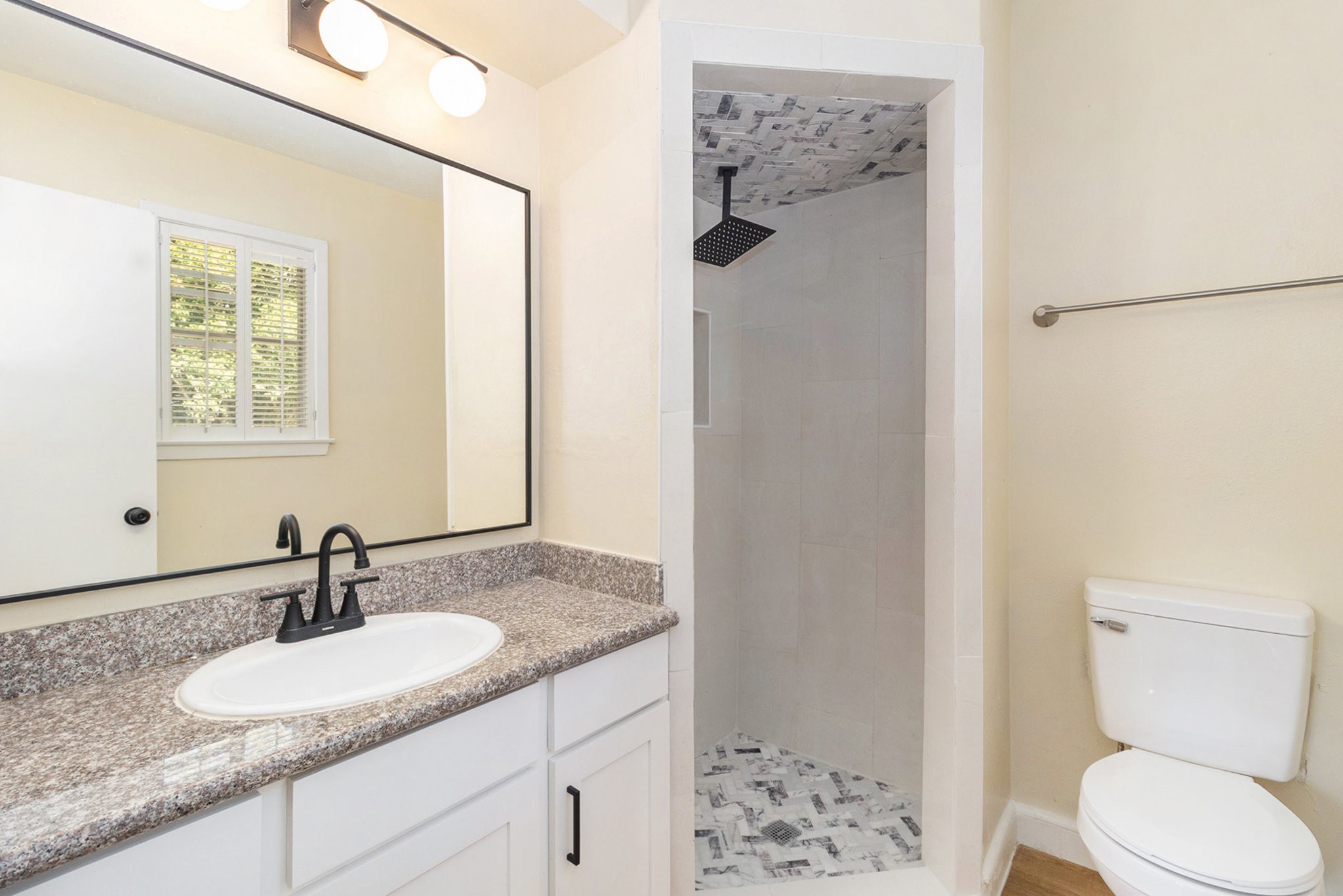 10331 Collingswood Road La Porte, TX 77571 - Photo 12 of 29 a bathroom with a granite countertop sink toilet and shower