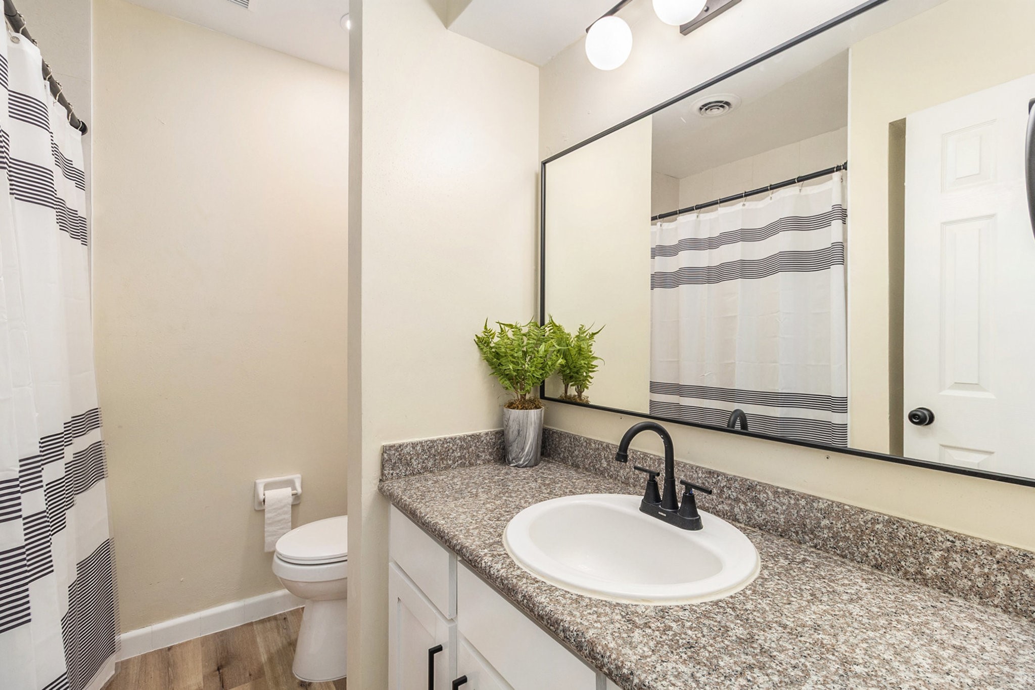 10331 Collingswood Road La Porte, TX 77571 - Photo 14 of 29 a bathroom with a granite countertop sink and a mirror