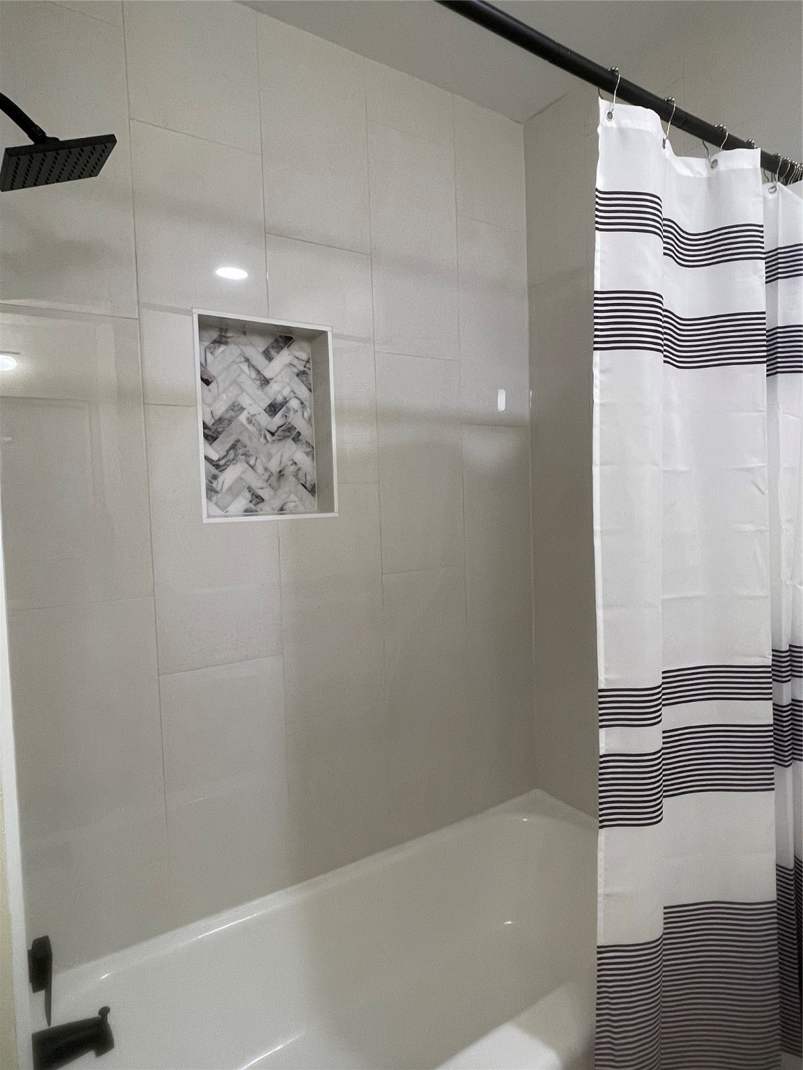 10331 Collingswood Road La Porte, TX 77571 - Photo 15 of 29 a bathroom with a bathtub and a shower