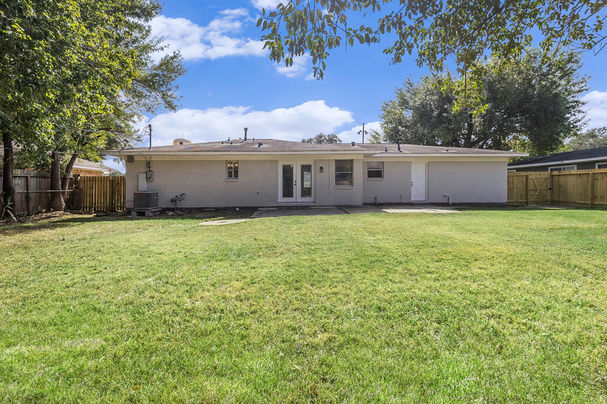 10331 Collingswood Road La Porte, TX 77571 - Photo 17 of 29 a view of a house with a yard and large trees