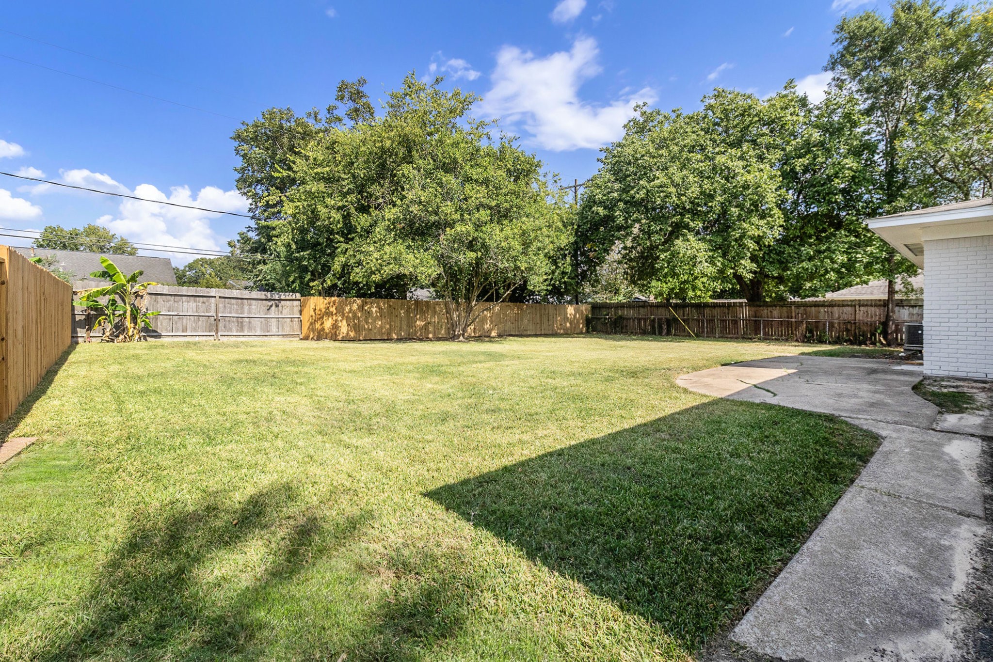 10331 Collingswood Road La Porte, TX 77571 - Photo 18 of 29 a swimming pool with an outdoor seating and a lots of trees