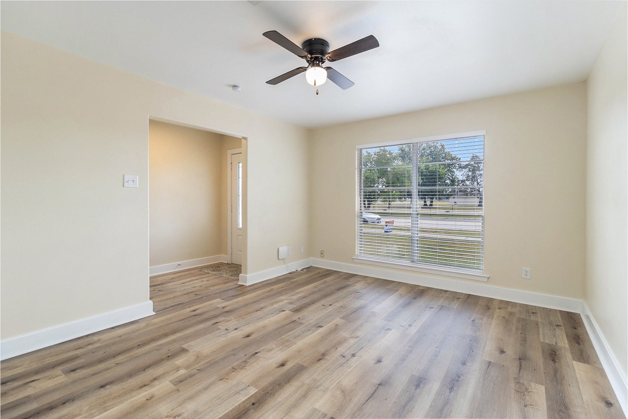 10331 Collingswood Road La Porte, TX 77571 - Photo 5 of 29 an empty room with wooden floor and windows
