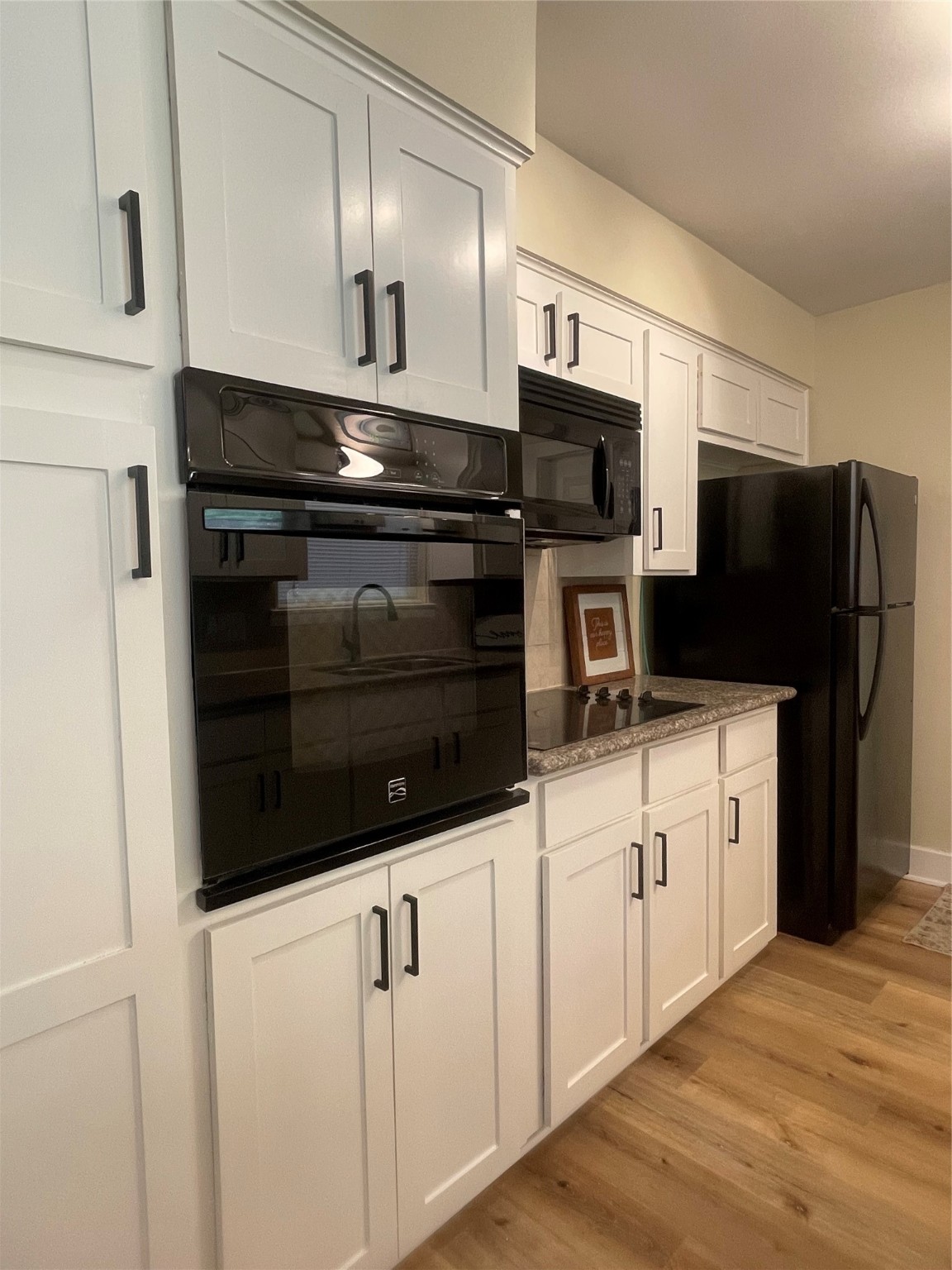 10331 Collingswood Road La Porte, TX 77571 - Photo 8 of 29 a kitchen with stainless steel appliances white cabinets and a refrigerator