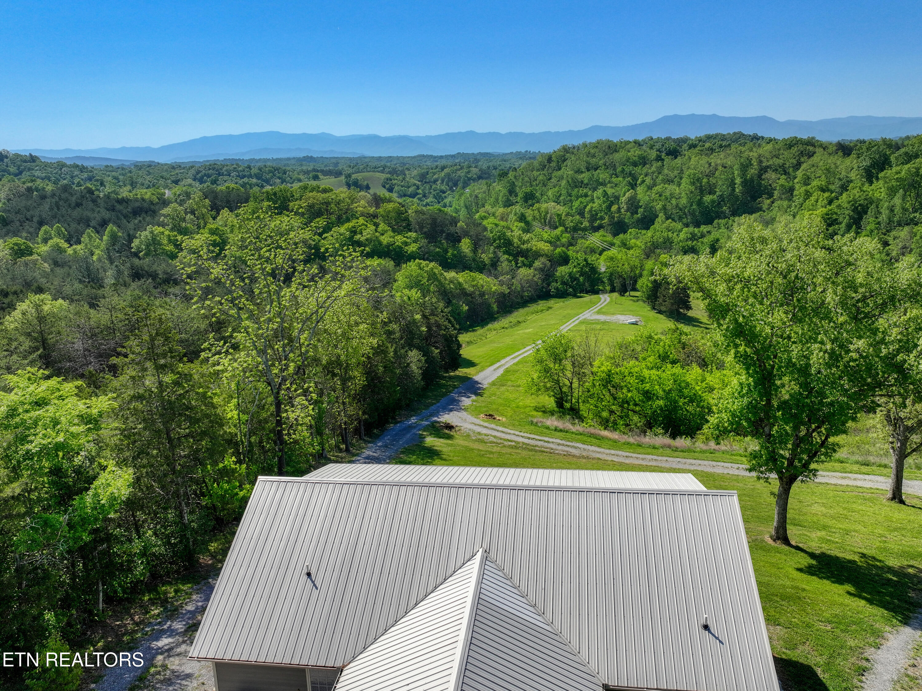 1424 Millican Grove Road Sevierville, TN 37876 - Photo 3 of 29 DJI_20260422105202_0450_D_79