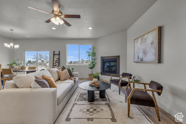 155 East 360th Street East, Unit 10B Fillmore, UT 84631 - Photo 1 of 43 Living room with light hardwood / wood-style flooring and ceiling fan with notable chandelier