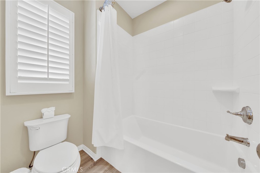 75 Gardenstone Path Irvine, CA 92620 - Photo 50 of 65 a white toilet sitting next to a bath tub