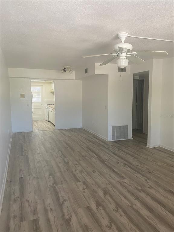 911 Washington Avenue Southwest, Unit 212 Largo, FL 33770 - Photo 13 of 20 wooden floor in an empty room