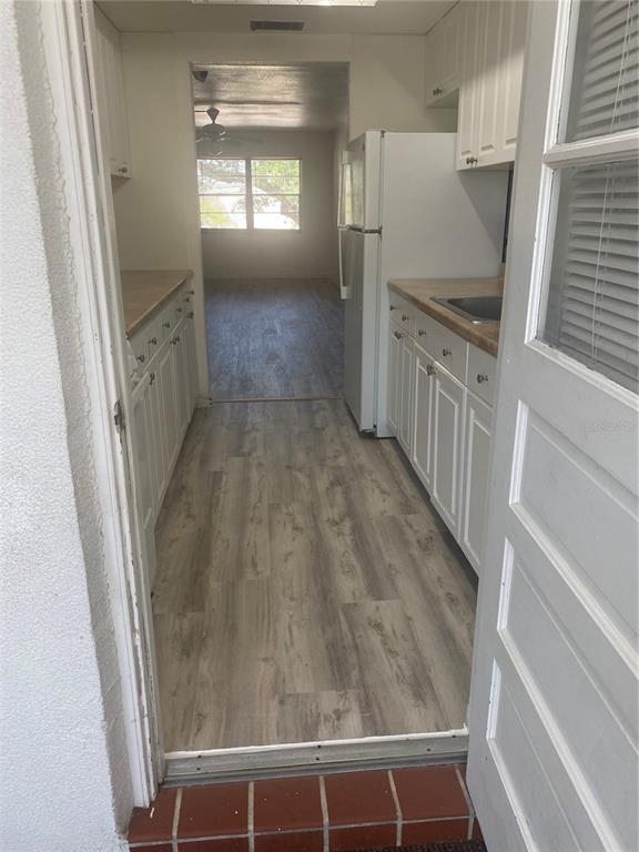 911 Washington Avenue Southwest, Unit 212 Largo, FL 33770 - Photo 14 of 20 a view of entryway with kitchen and a window