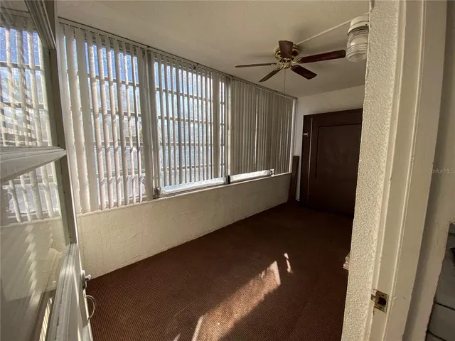 a picture of a bench in front of a wall