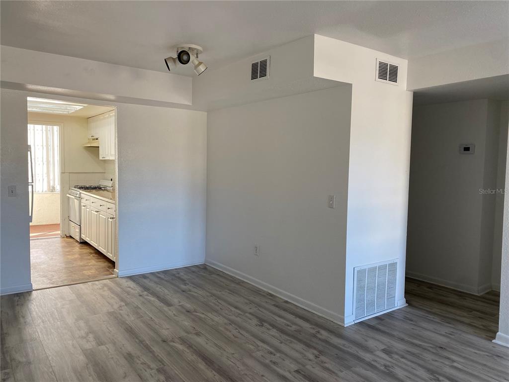 911 Washington Avenue Southwest, Unit 212 Largo, FL 33770 - Photo 4 of 20 a view of a hallway with wooden floor