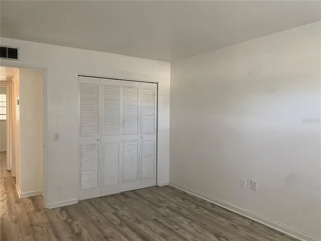 a bathroom with a double vanity sink toilet and shower