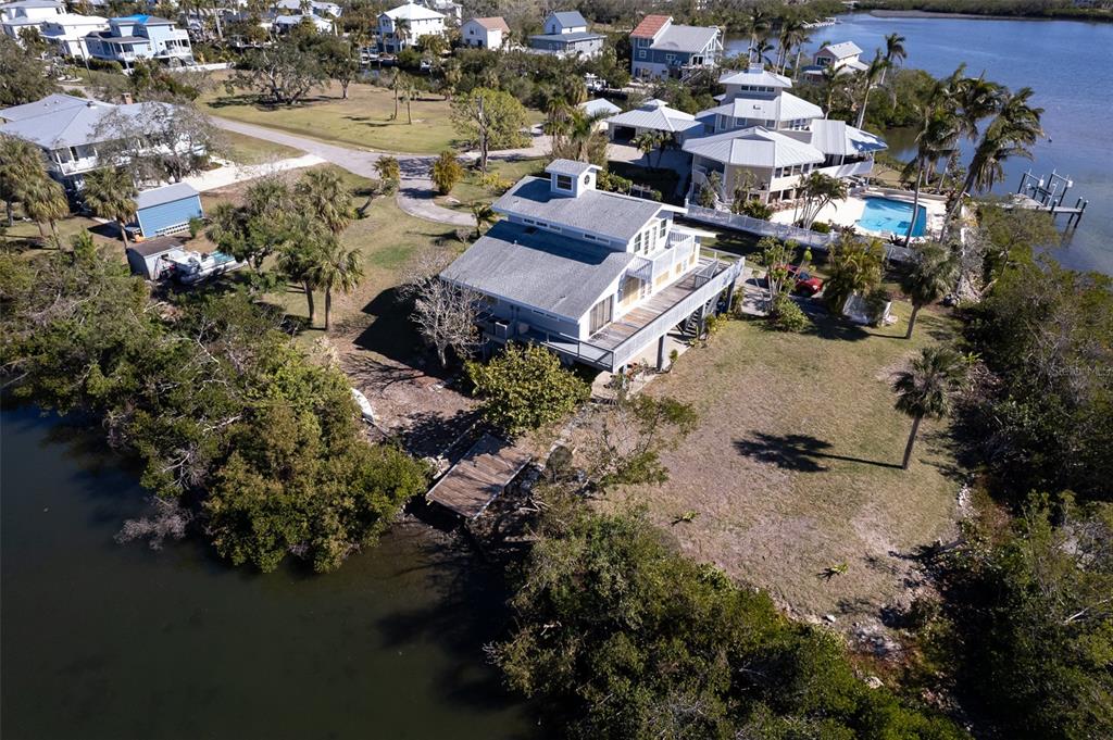 145 Burns Road Terra Ceia, FL 34250 - Photo 31 of 65 an aerial view of a houses with yard