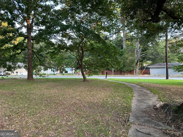 a view of a tree in the middle of a yard