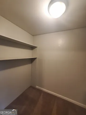 an empty room with a empty space and window