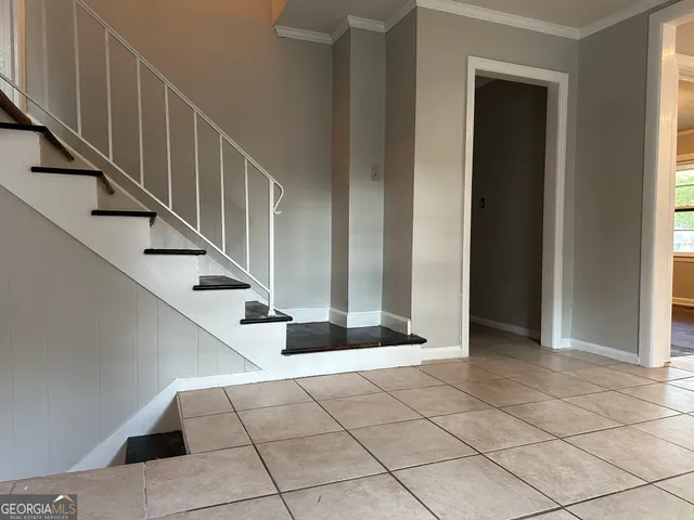 a view of entryway and hall with a window