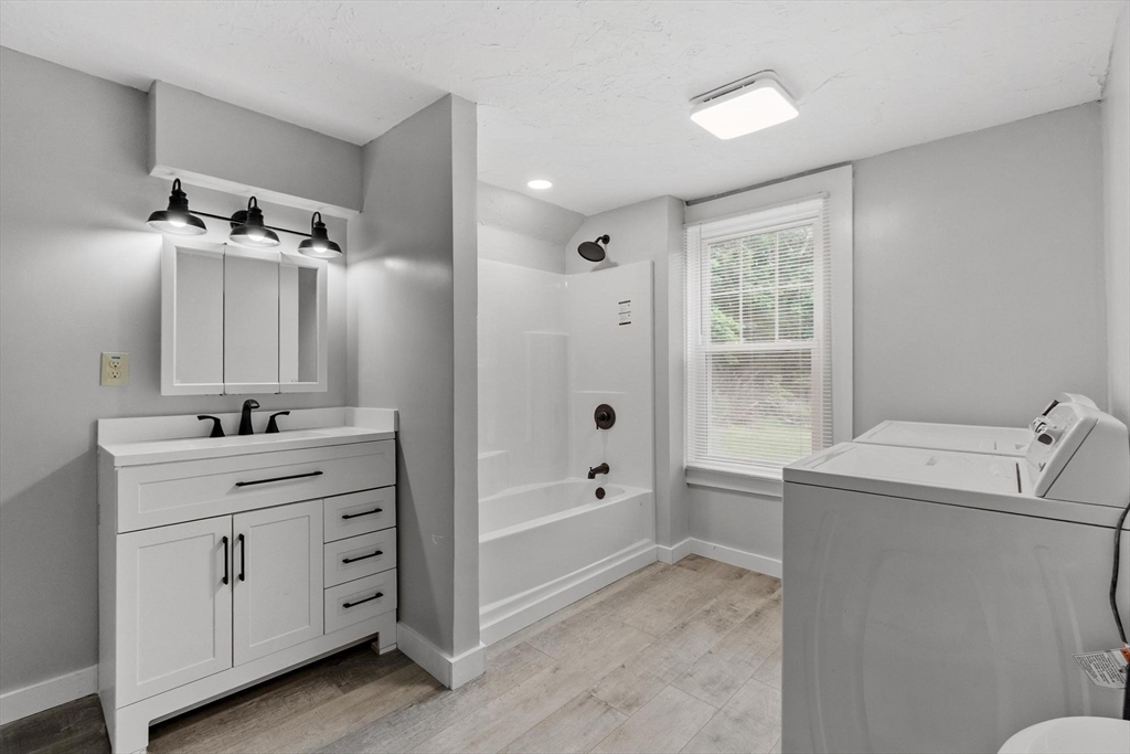 258 Allen Road Ashby, MA 01431 - Photo 18 of 36 a bathroom with a sink a toilet and shower