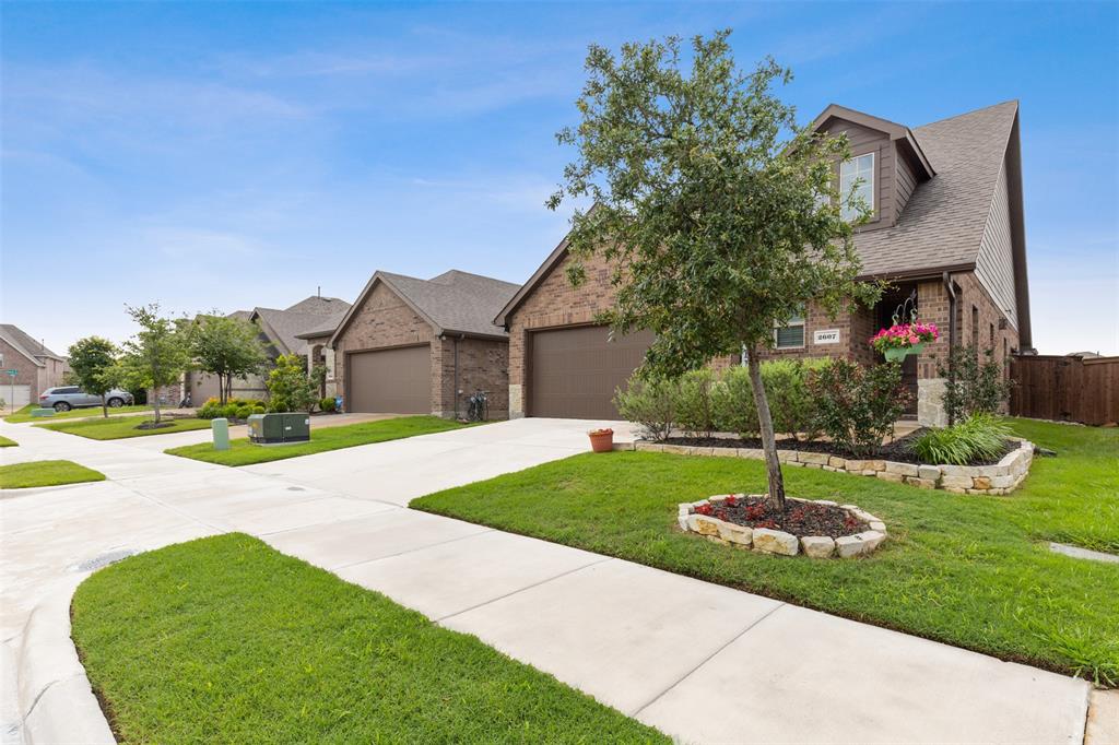 2607 Pinckney Court Forney, TX 75126 - Photo 19 of 27 a front view of a house with garden