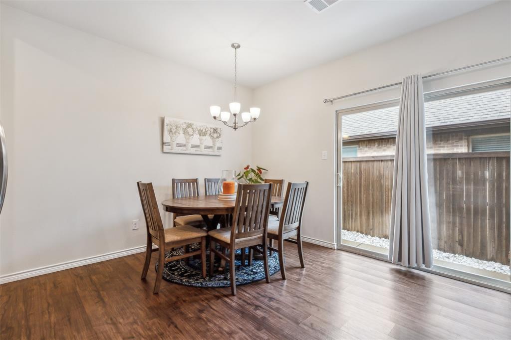 2607 Pinckney Court Forney, TX 75126 - Photo 6 of 27 a view of a dining room with furniture window and wooden floor