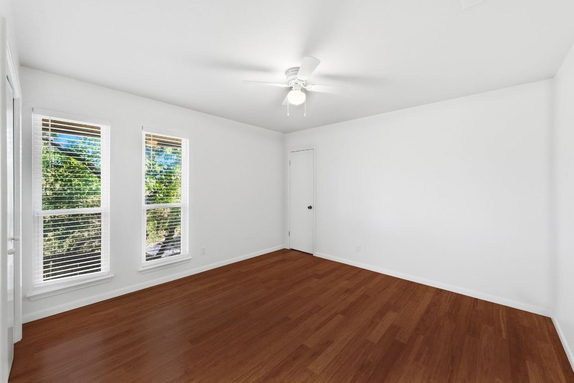 6210 Shadow Valley Drive, Unit A Austin, TX 78731 - Photo 23 of 29 Secondary bedroom featuring wood finished floors and ceiling fan