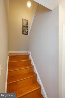 a view of a hallway with white walls