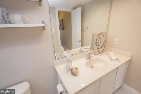 a bedroom with a bed and chandelier