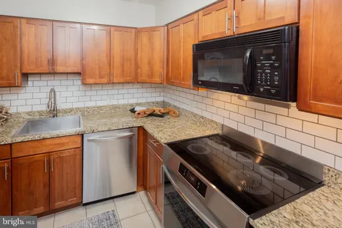 a kitchen with a stove and a sink