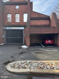 a picture of a bench in front of a building