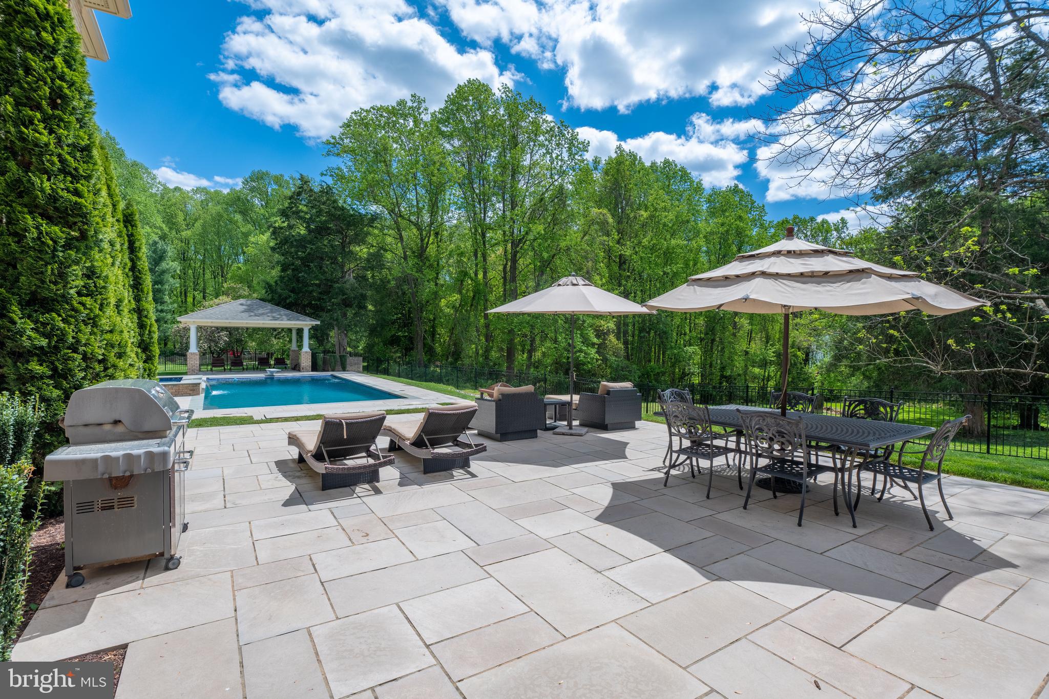 Tiered hardscape facing resort style pool & spa