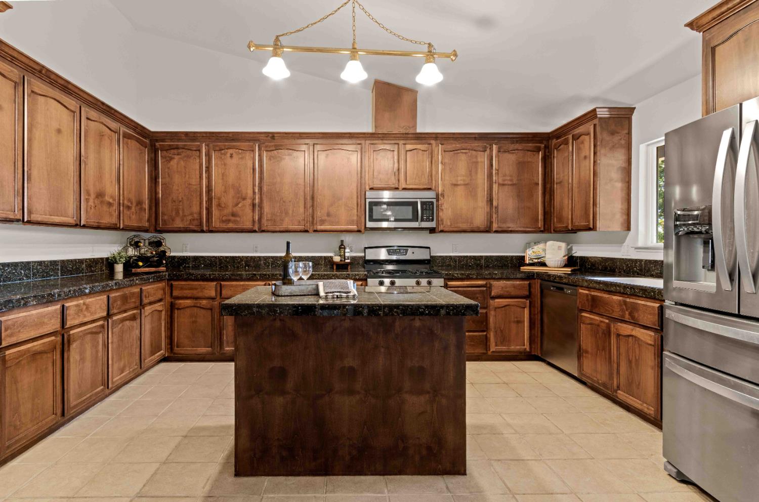 5341 Puerta Del Sol Road Camino, CA 95709 - Photo 7 of 32 a kitchen with stainless steel appliances granite countertop a sink stove and refrigerator