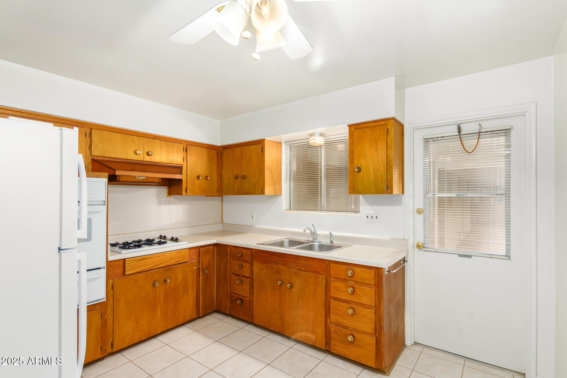 6242 North 12th Place, Unit 2 Phoenix, AZ 85014 - Photo 5 of 5 a kitchen with a sink cabinets and window