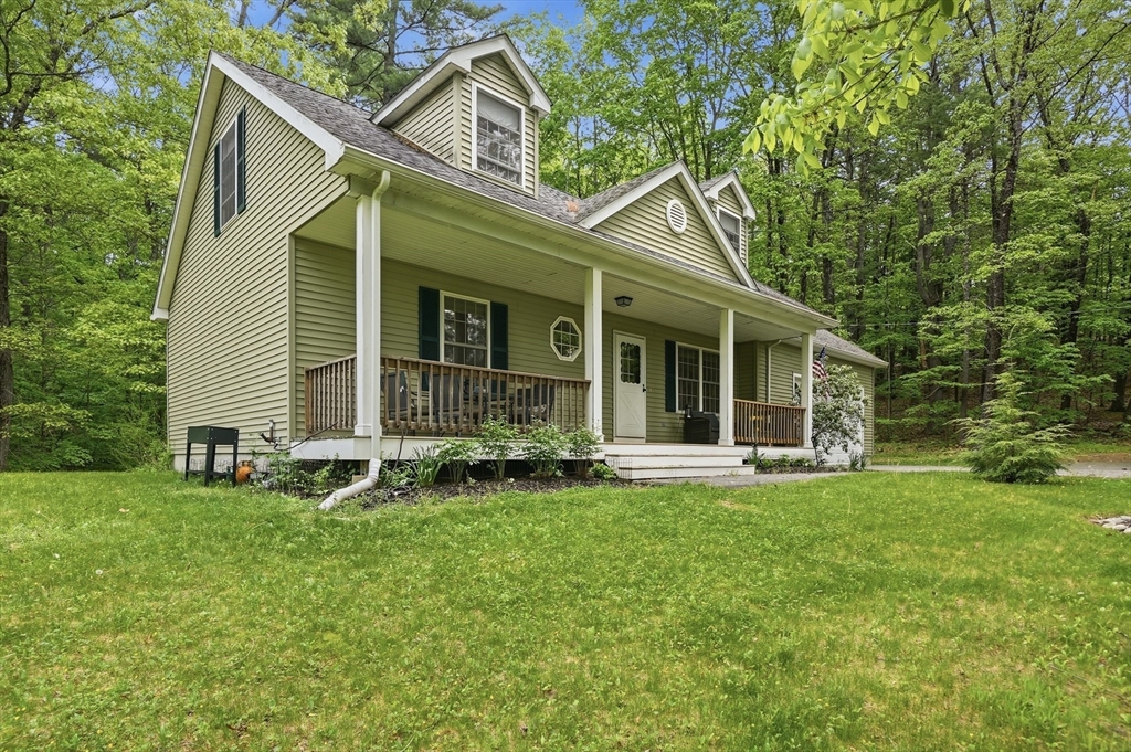 186 Common Street Groton, MA 01450 - Photo 3 of 28 a view of a house with a yard and sitting area