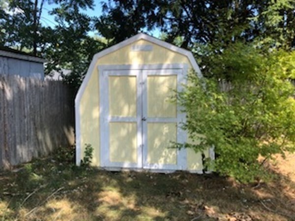 216 Mallowhill Road Springfield, MA 01129 - Photo 12 of 15 a view of a tiny house with a yard