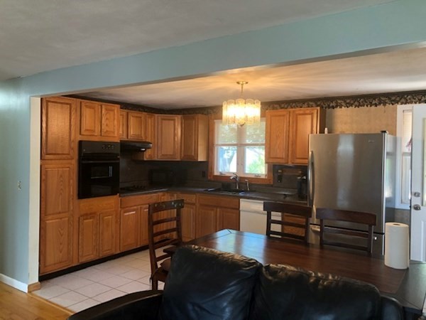216 Mallowhill Road Springfield, MA 01129 - Photo 2 of 15 a kitchen with counter top space cabinets and appliances