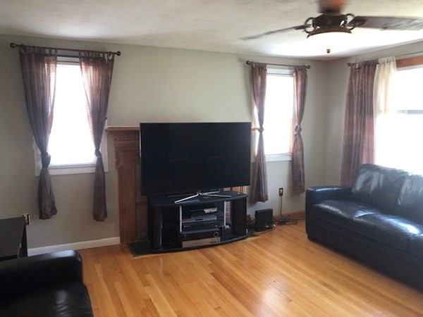 216 Mallowhill Road Springfield, MA 01129 - Photo 4 of 15 a living room with furniture and a flat screen tv