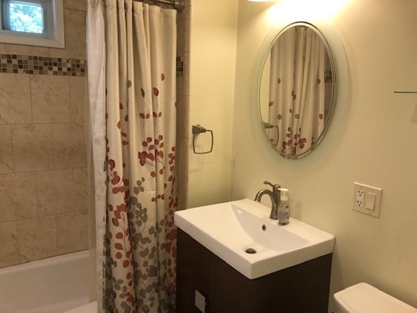 216 Mallowhill Road Springfield, MA 01129 - Photo 5 of 15 a bathroom with a sink a mirror and a shower