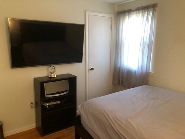 216 Mallowhill Road Springfield, MA 01129 - Photo 8 of 15 a bedroom with a bed and a television