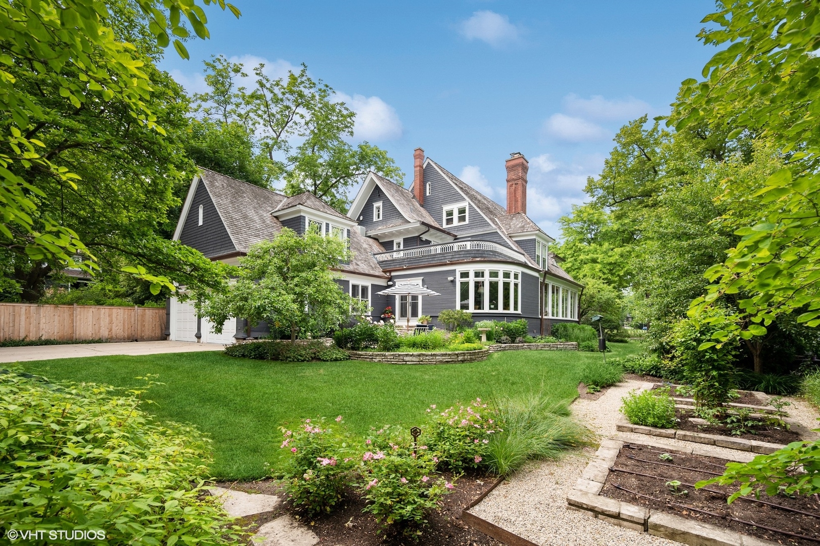 644 Oak Street Winnetka, IL 60093 - Photo 24 of 40 a front view of a house with a yard and potted plants