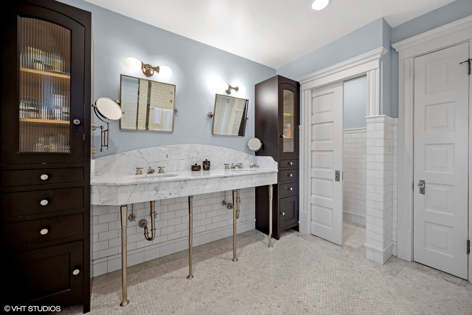 644 Oak Street Winnetka, IL 60093 - Photo 28 of 40 a view of bathroom with a sink a mirror and a vanity