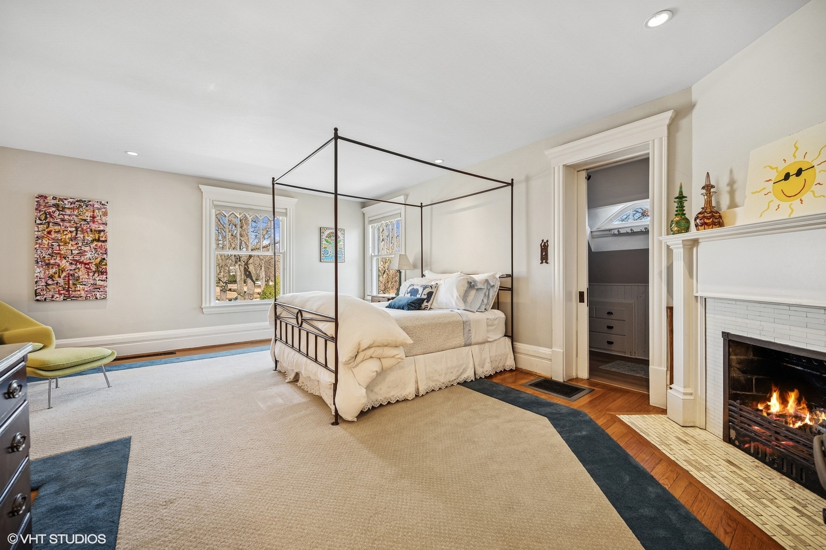 644 Oak Street Winnetka, IL 60093 - Photo 29 of 40 a spacious bedroom with a bed and a fireplace