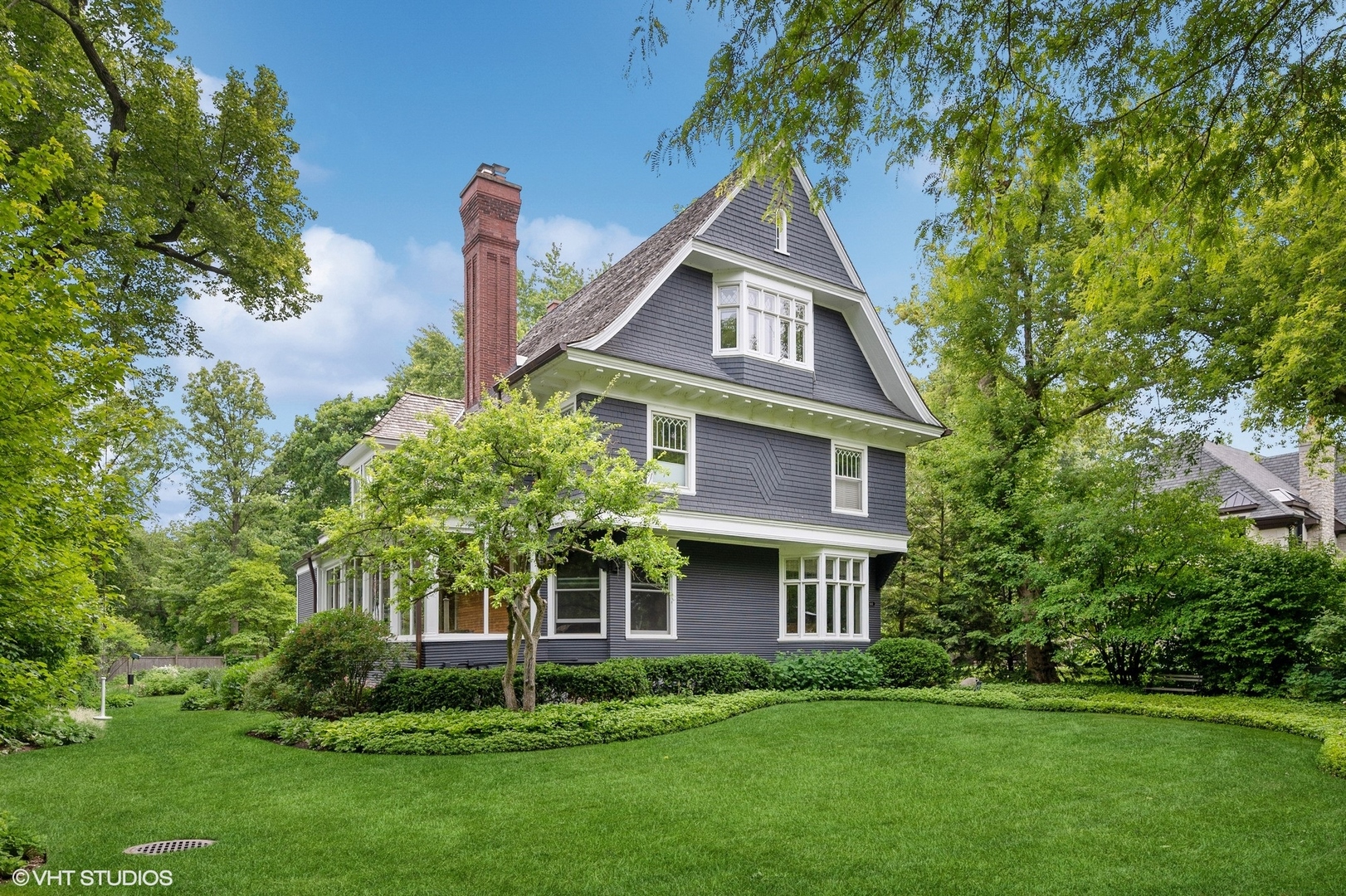 644 Oak Street Winnetka, IL 60093 - Photo 3 of 40 a front view of a house with a yard and trees