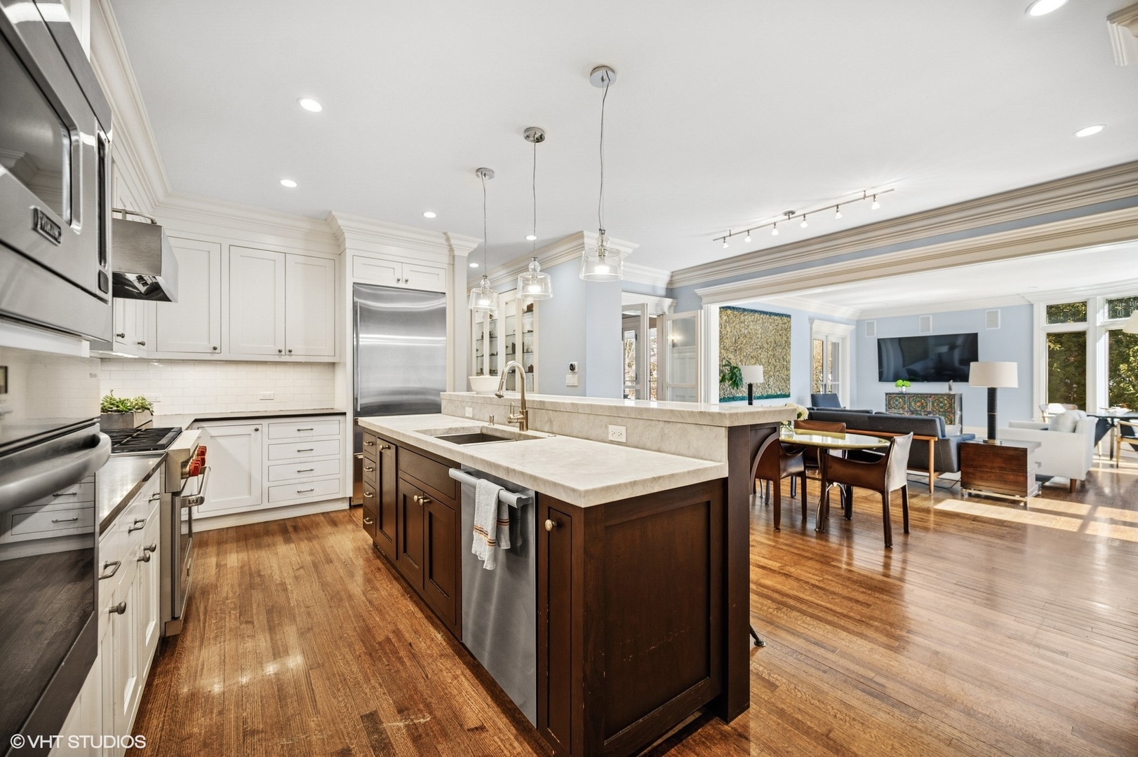 644 Oak Street Winnetka, IL 60093 - Photo 7 of 40 a large kitchen with stainless steel appliances granite countertop a stove and a wooden floors