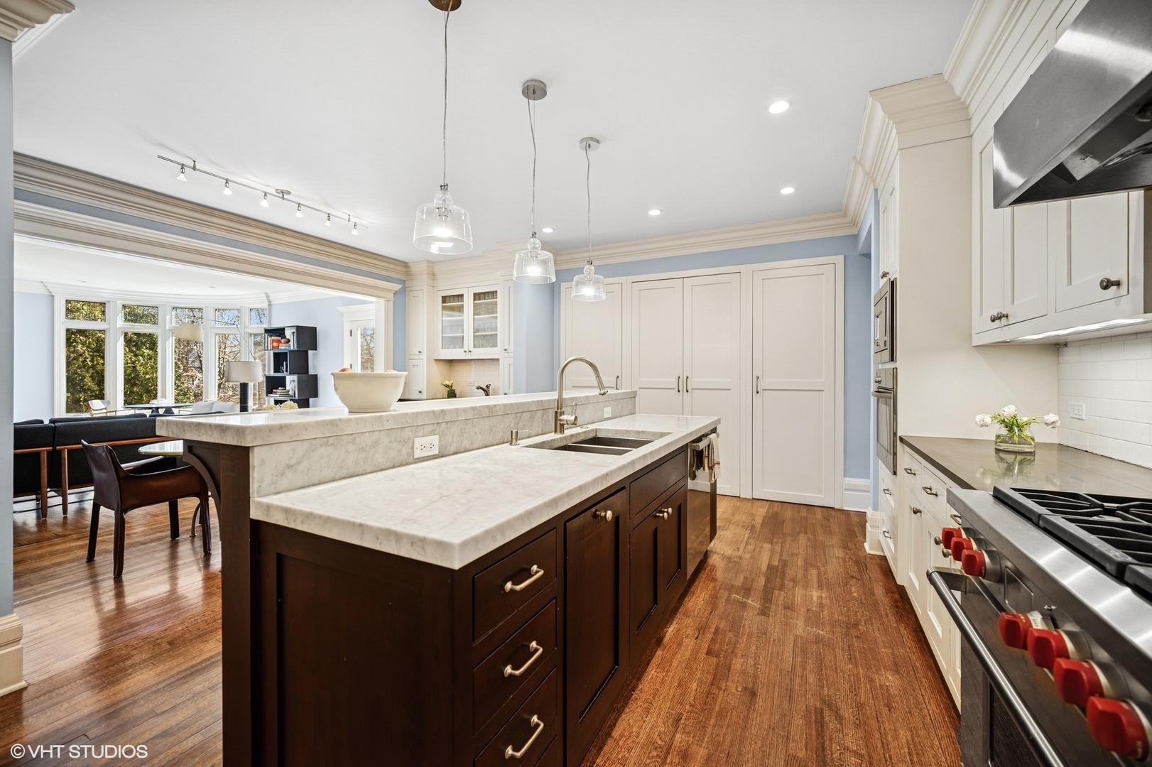 644 Oak Street Winnetka, IL 60093 - Photo 8 of 40 a kitchen with kitchen island granite countertop a sink appliances and cabinets