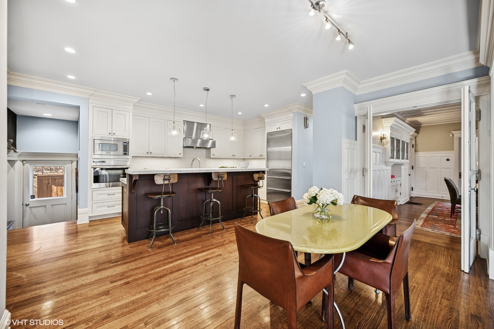 644 Oak Street Winnetka, IL 60093 - Photo 9 of 40 a kitchen with a table and chairs in it