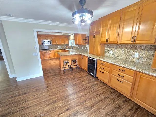 a bathroom with a granite countertop toilet sink and mirror